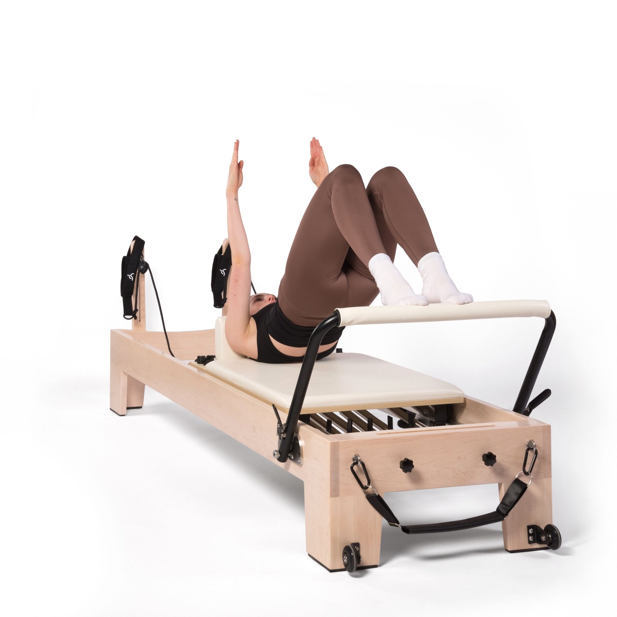 fille exercice pilates reformer
