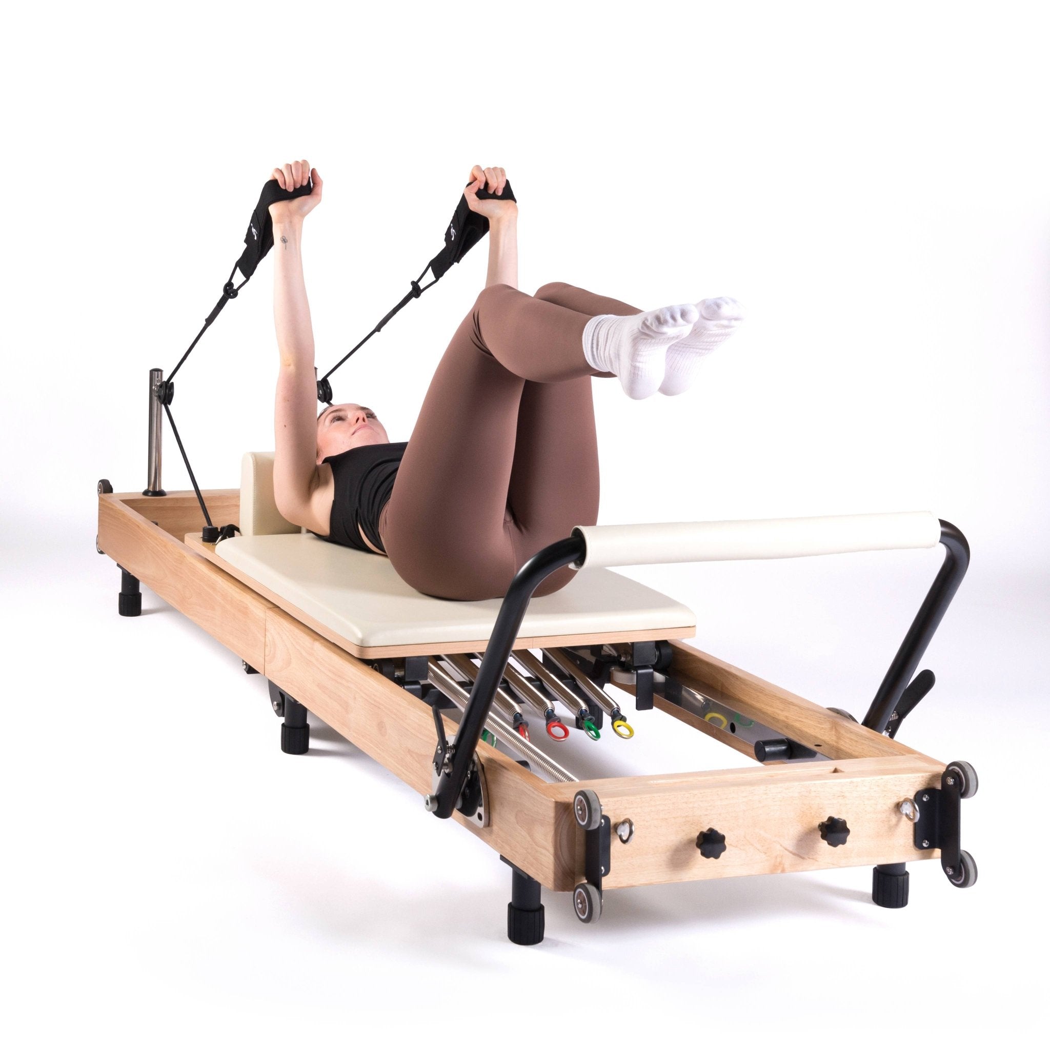 exercices de pilates reformer beige