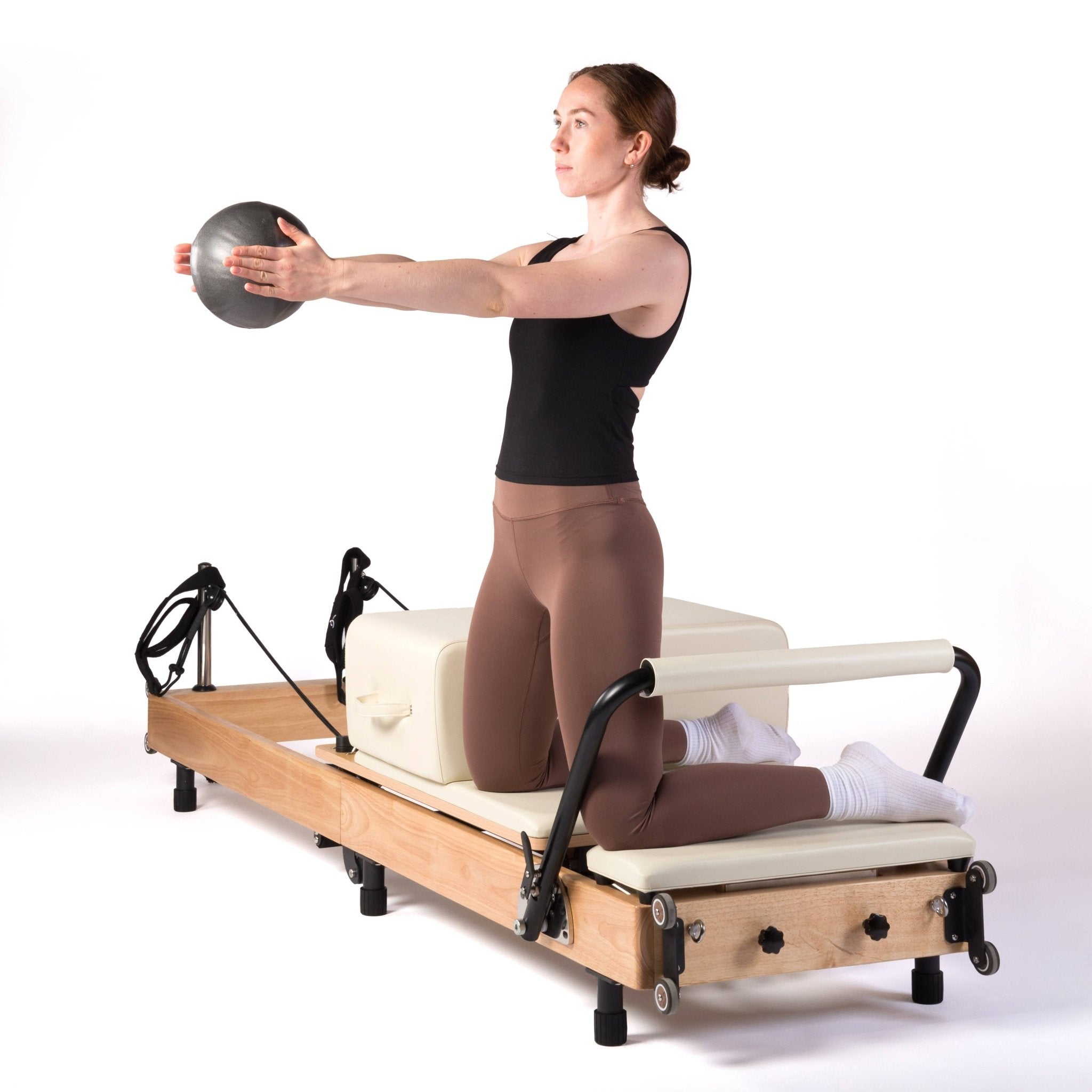 exercices de pilates reformer avec ballon