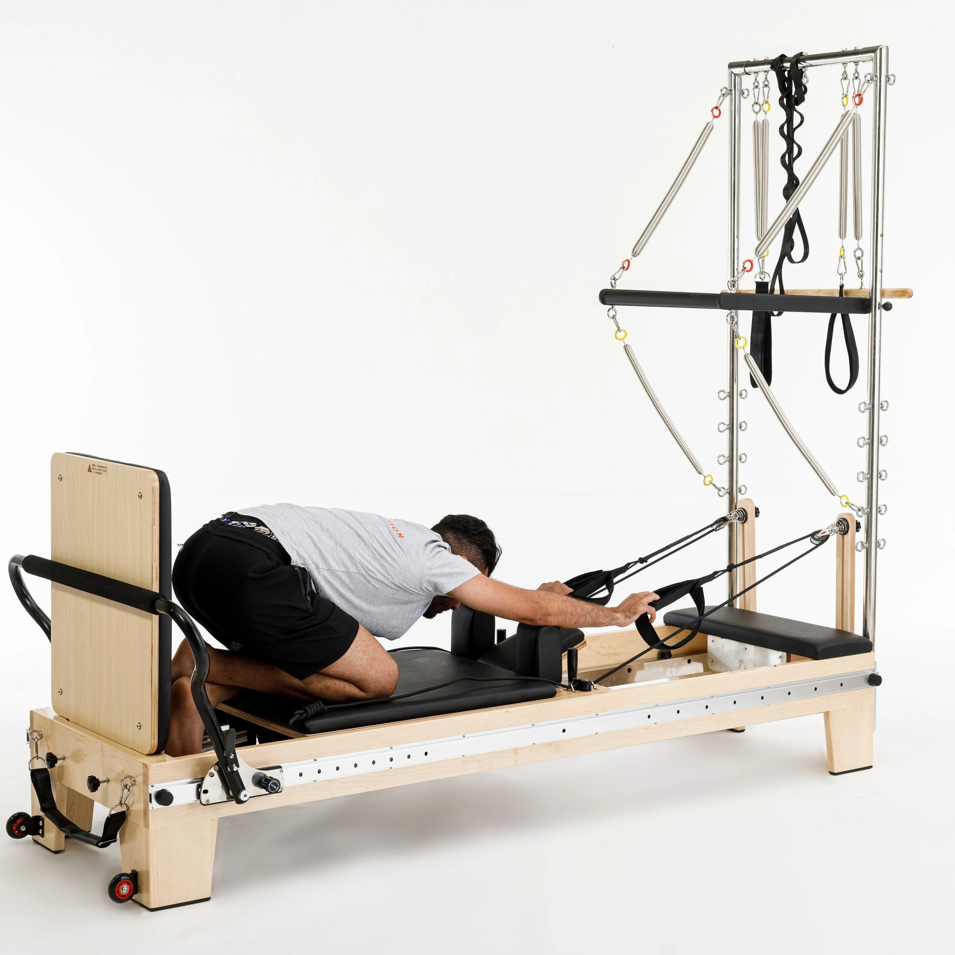 pilates reformer à tour trapèze