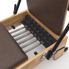 Pilates reformer classique moka, ressorts à code couleur