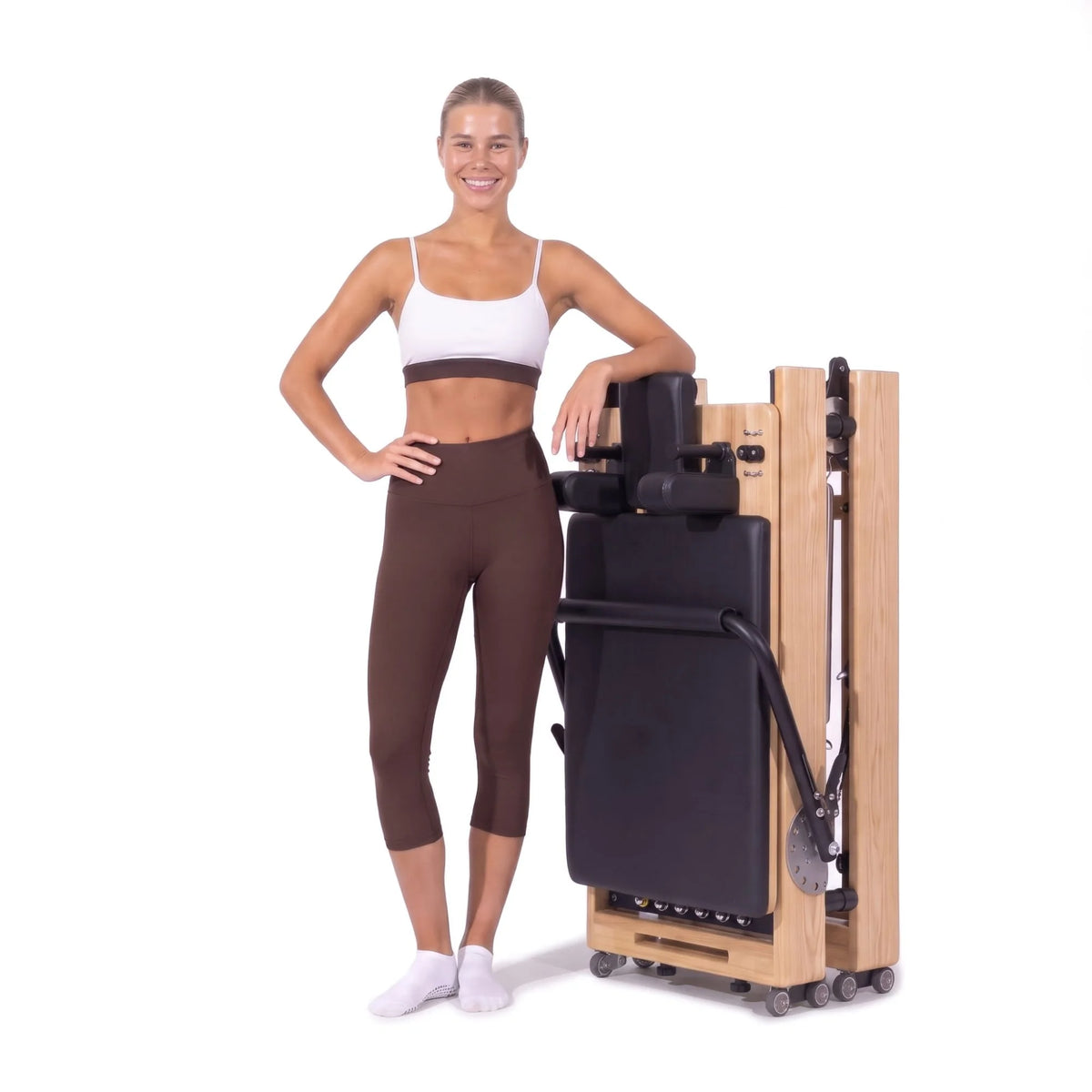 Pilates reformer pliable Flexi noir, plié et rangé debout